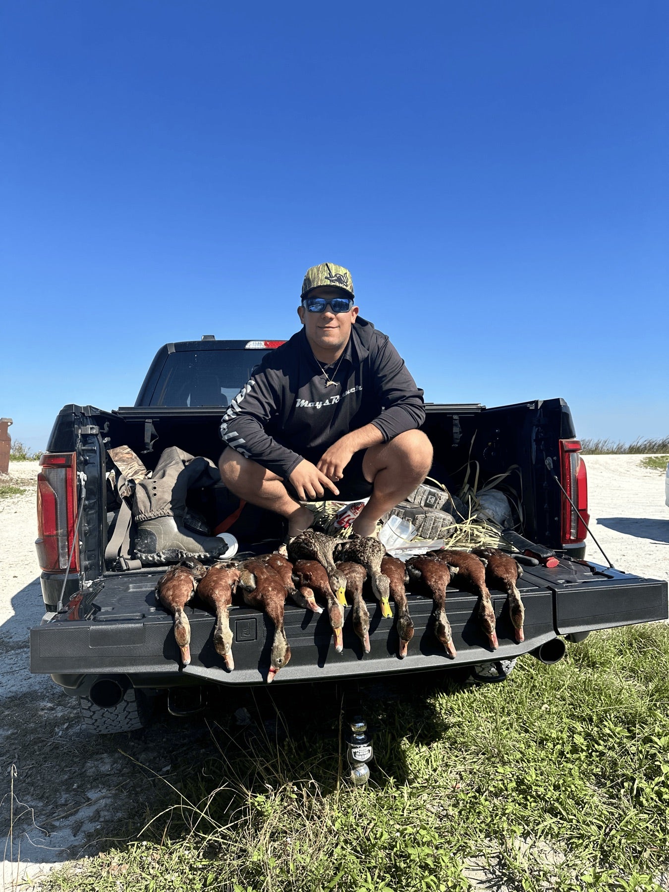 Marsh Mayhem field hunt photo with ducks on a truck tailgate